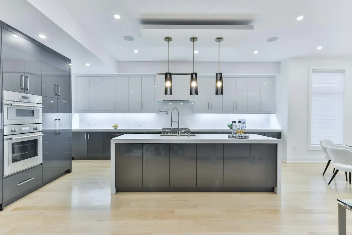 Large kitchen island with pale worktops and integrated storage