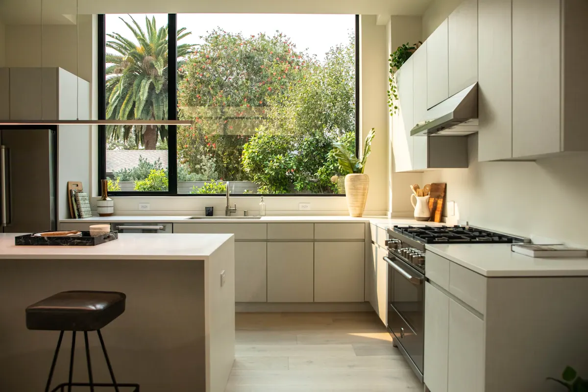 Kitchen island facing a large garden window