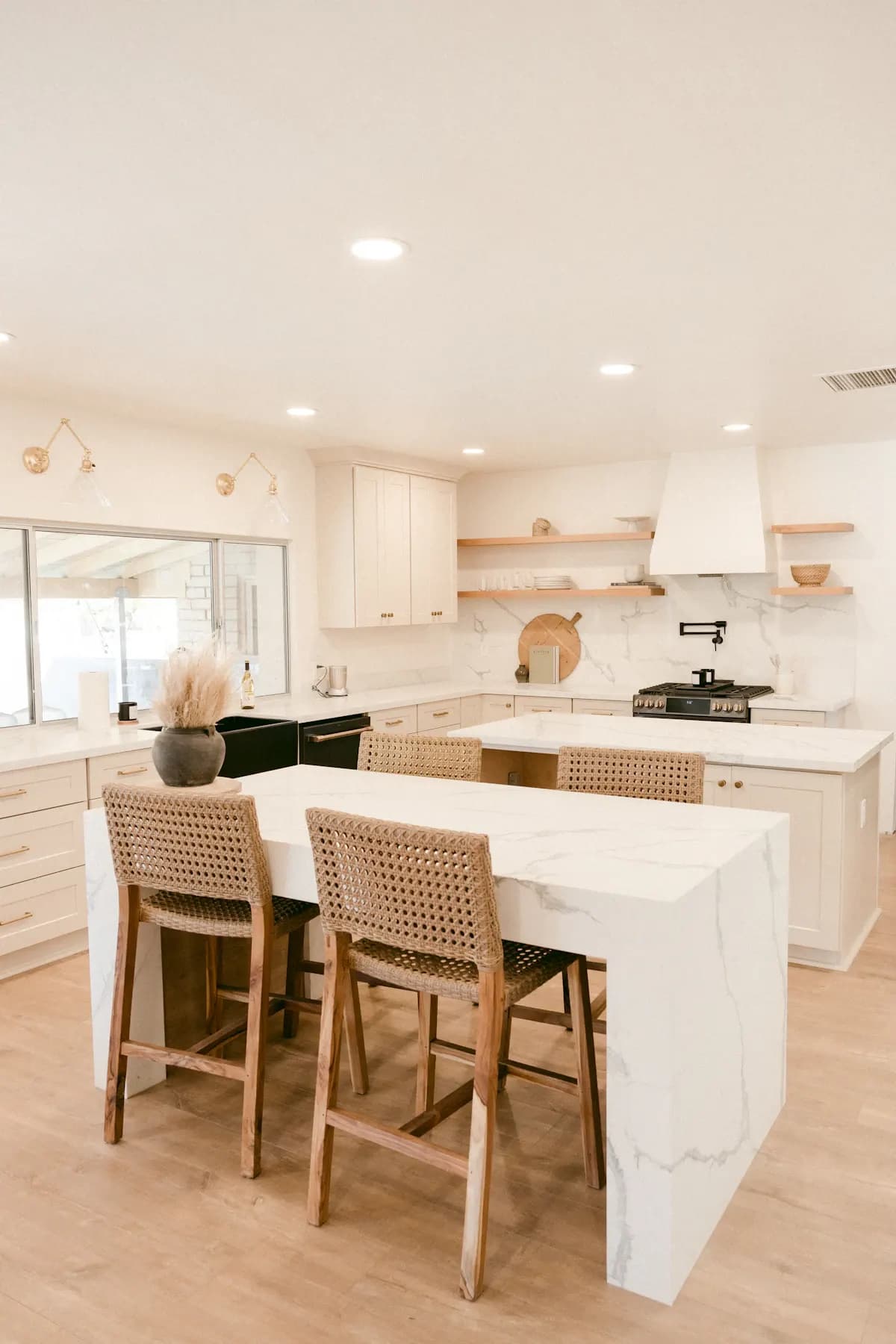 White kitchen island with timber stools