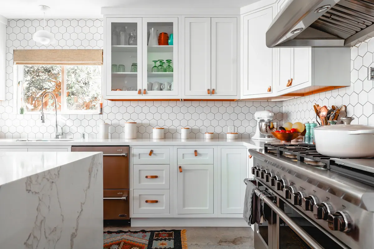 Traditional white kitchen with a large range and pale worktops